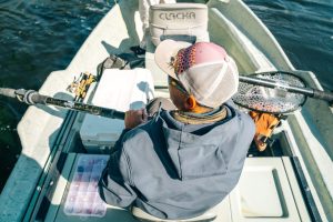 Image of person fishing from a dinghy to illustrate post.