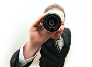 Image of man looking through telescope to illustrate post