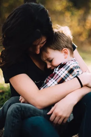 Image of mother cuddling child to illustrate post