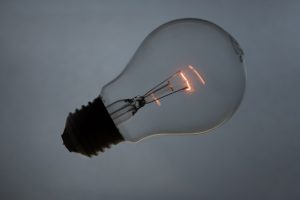 Image of a single lightbulb with faintly glowing filament, to illustrate post