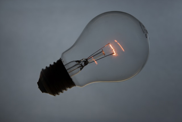 Image of a single lightbulb with faintly glowing filament, to illustrate post