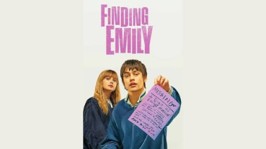 Image of the two lead actors, with the film title above their heads, and the male lead holding some document, used to illustrate the post